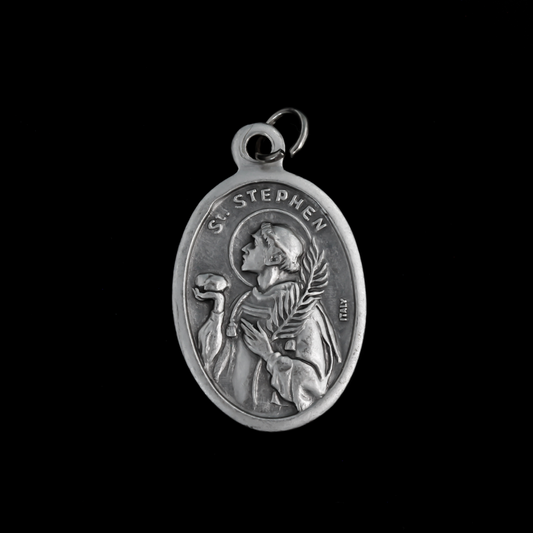 Saint Stephen oval medal that depicts the saint holding a rock on the front and "Pray For Us" on the back