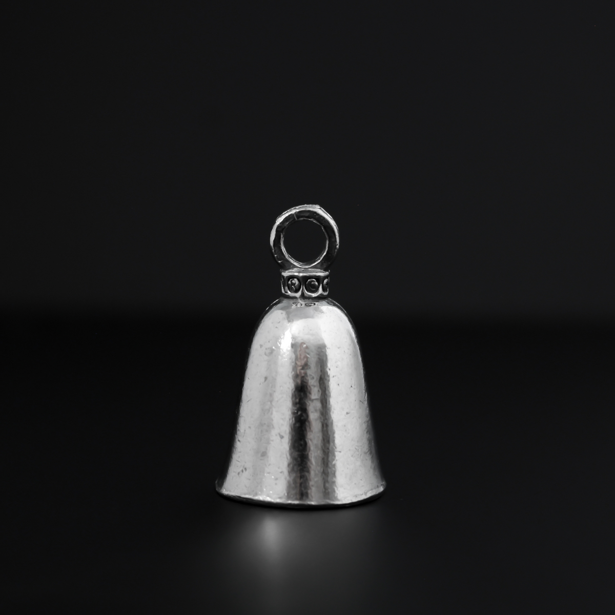 Saint Christopher Guardian bell that depicts the saint on the front surrounded by the words "Saint Christopher Protect Us"