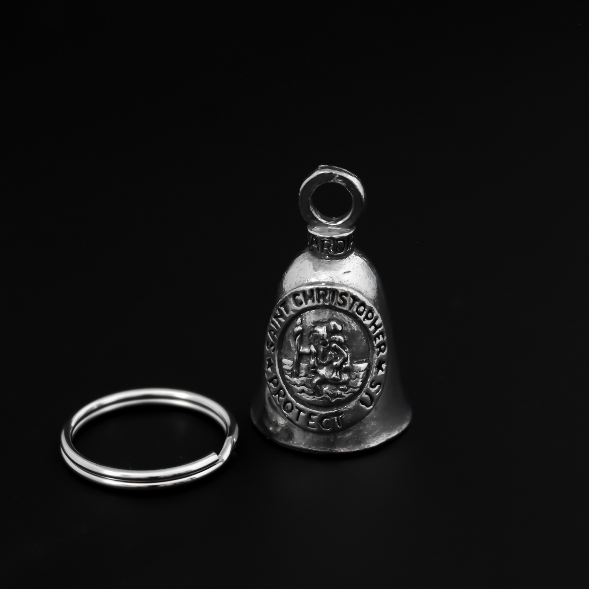 Saint Christopher Guardian bell that depicts the saint on the front surrounded by the words "Saint Christopher Protect Us"