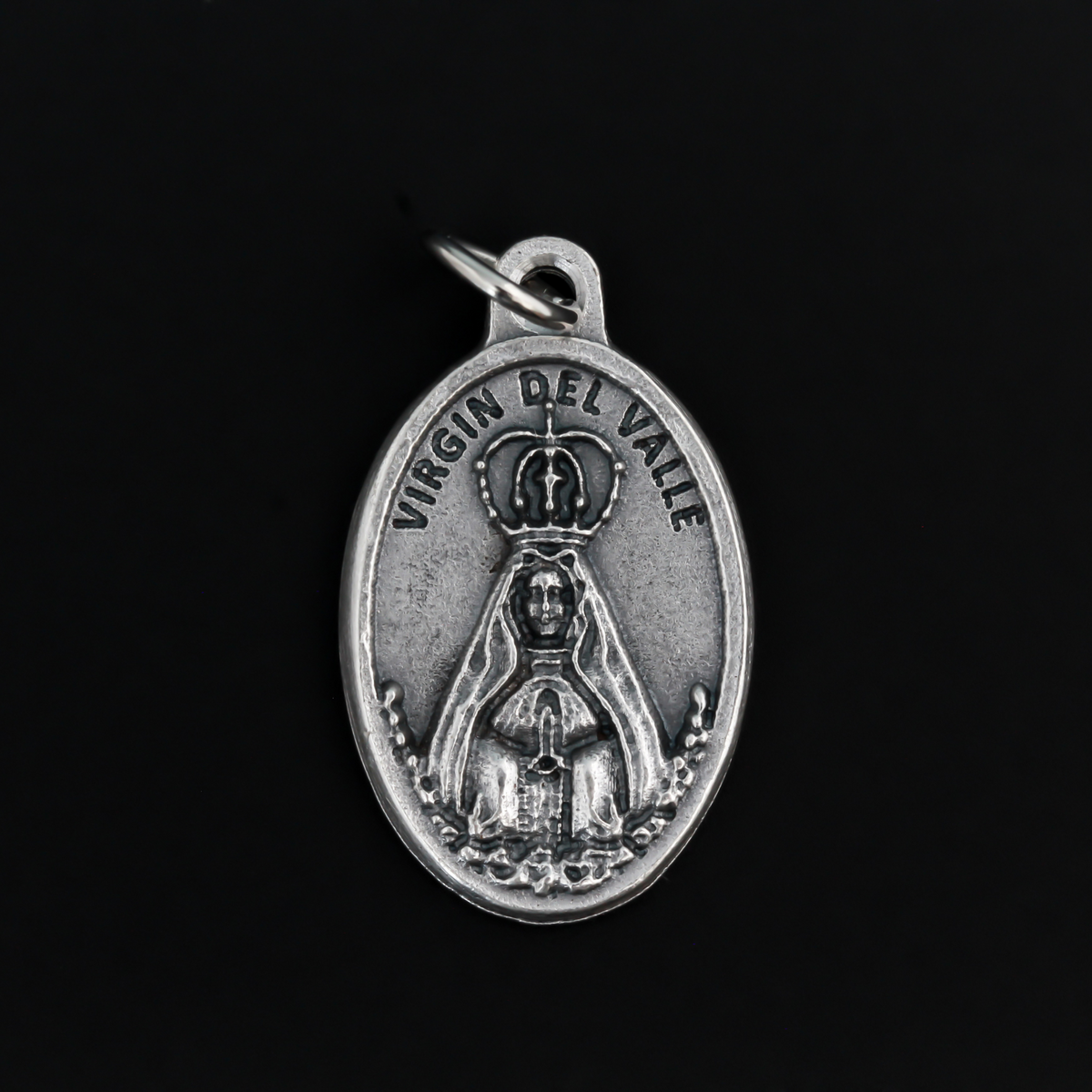 Virgin of the Valley medal that depicts Mary on the front and "Pray for us" on the back