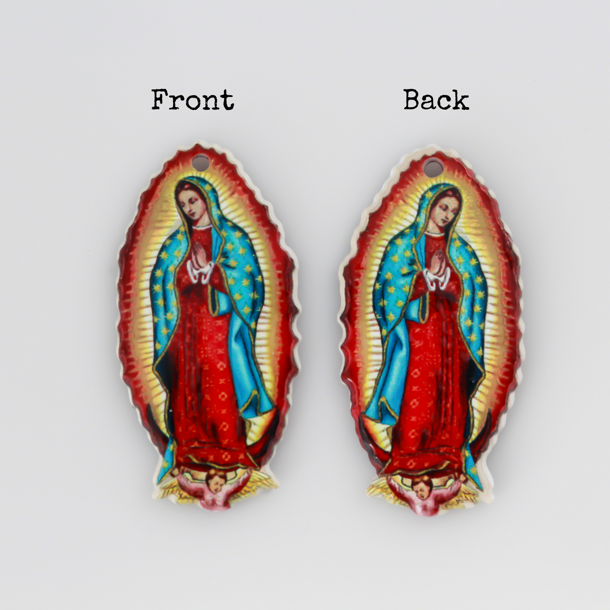 crylic pendants with a printed full color image of Our Lady of Guadalupe. The image is reversed on the backside