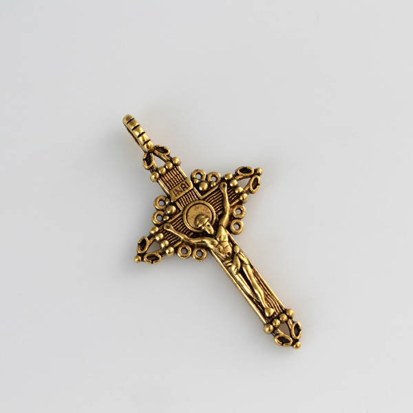 Three ornate crucifix crosses in an antiqued gold-tone color. This is a larger size crucifix measuring 2" long