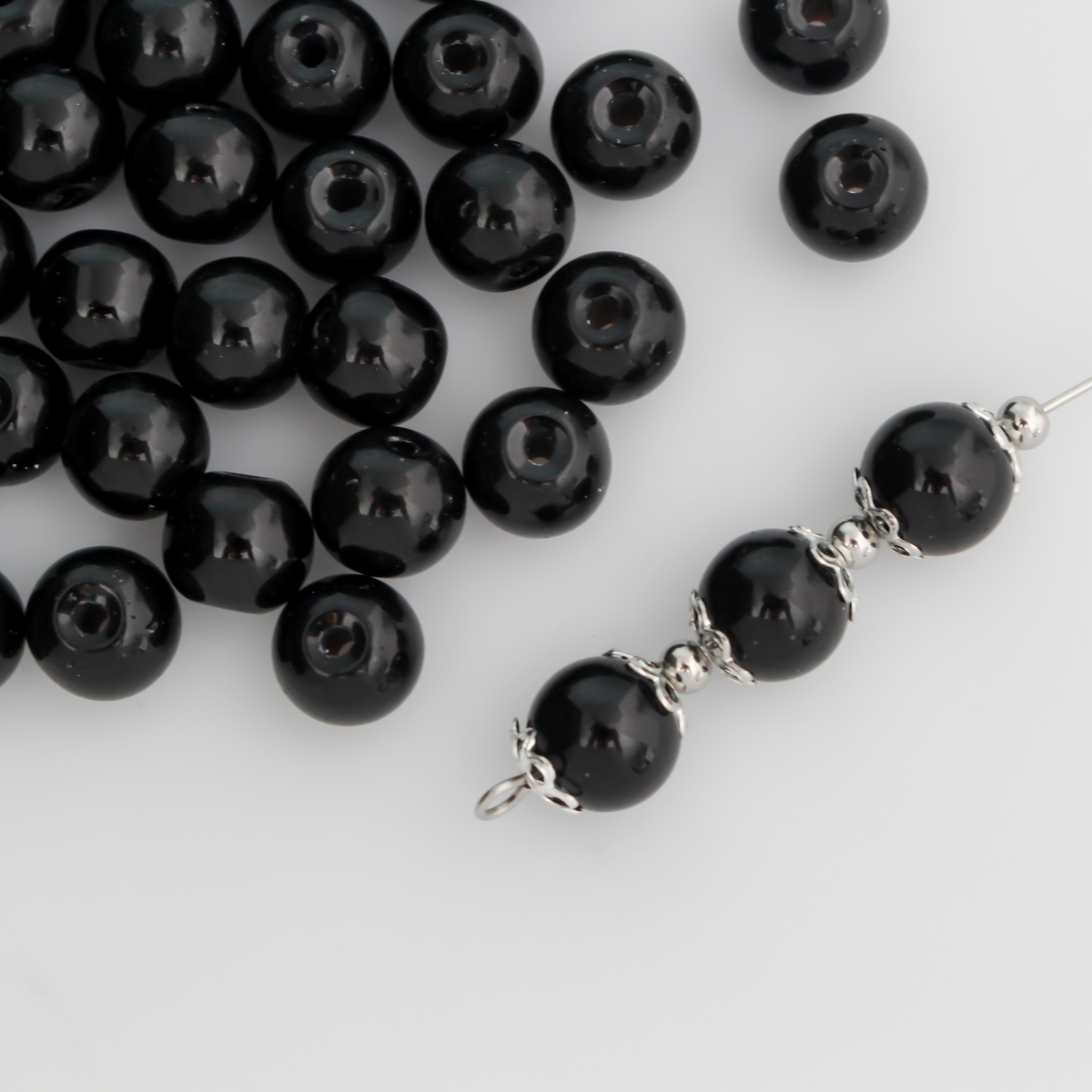 8mm round beads in a solid black color.