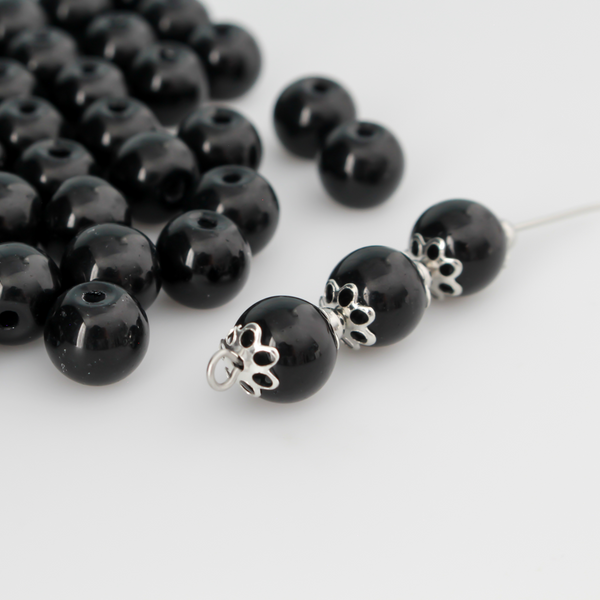 8mm round beads in a solid black color.