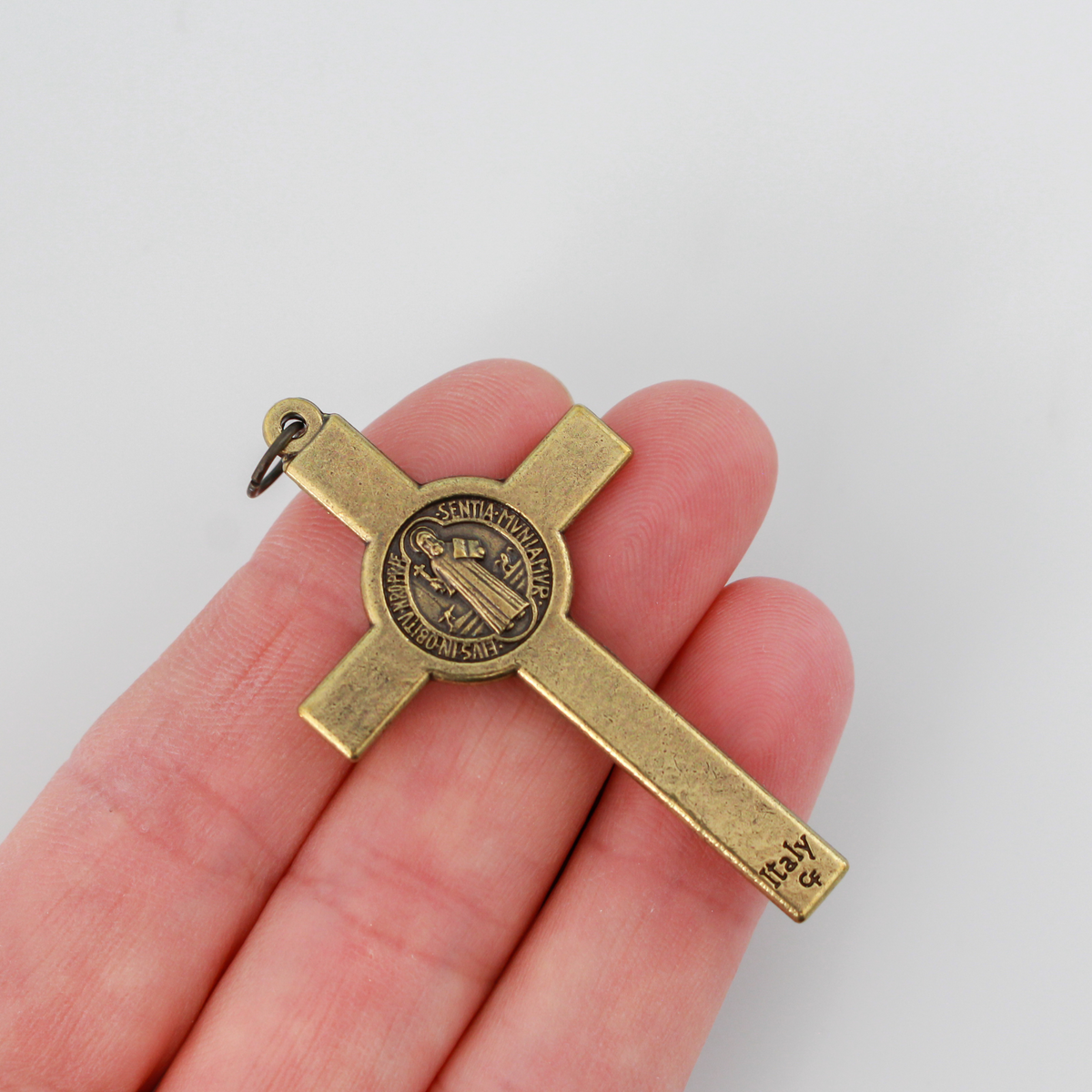 Bronze Saint Benedict crucifix that features a St. Benedict medal on the front and back