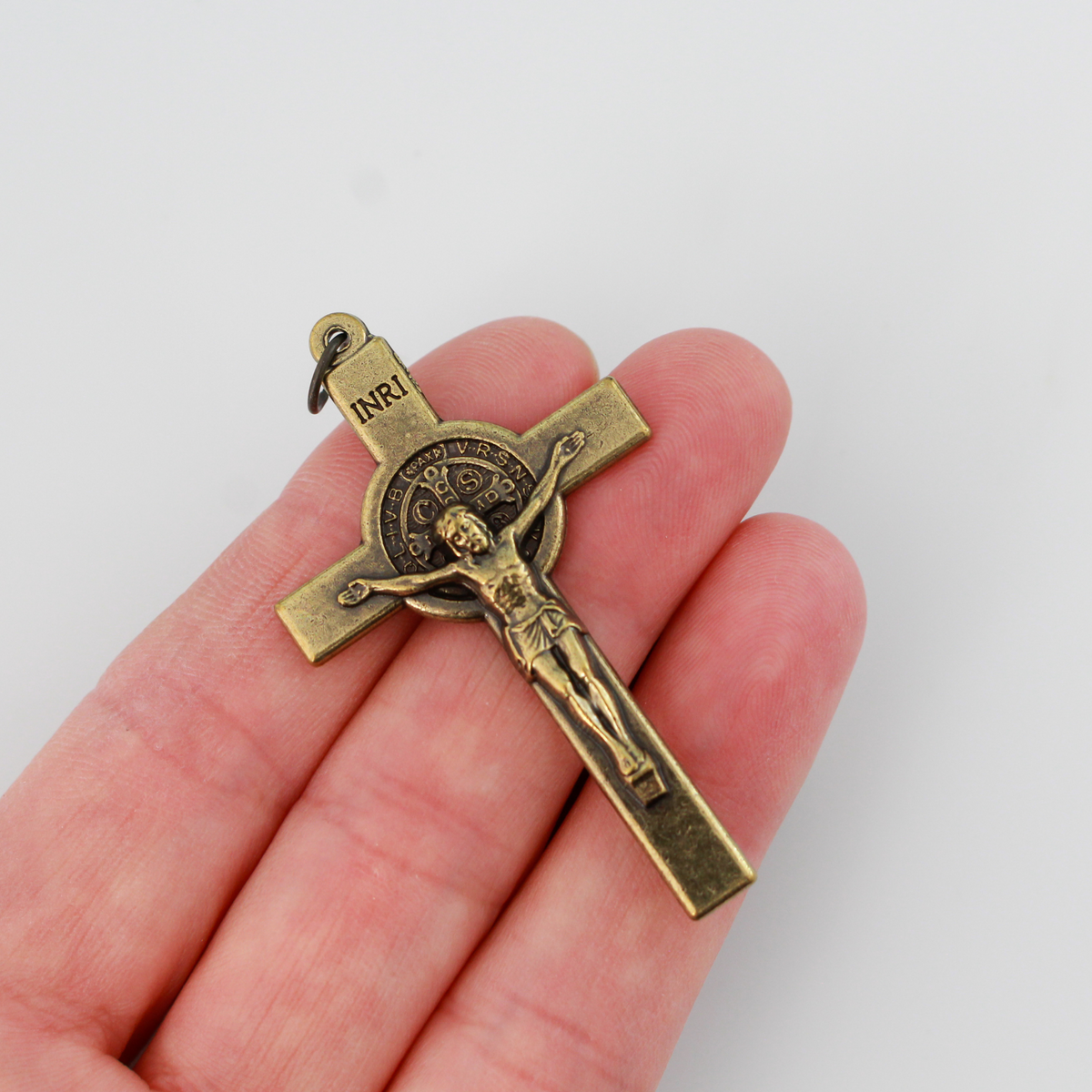 Bronze Saint Benedict crucifix that features a St. Benedict medal on the front and back