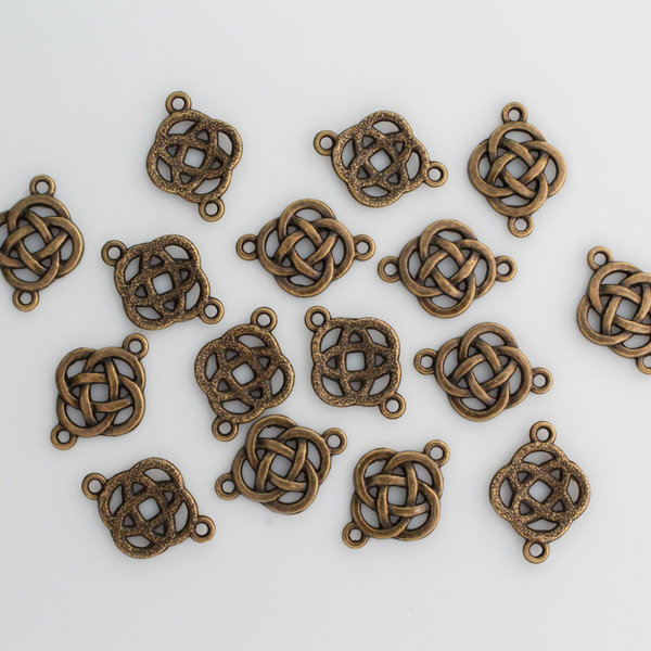 Bronze Celtic knot connectors with a filigree cut out design