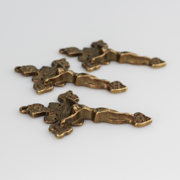 Ornate crucifix crosses in an antiqued bronze color. This is a larger size crucifix measuring 1-7/8" long.