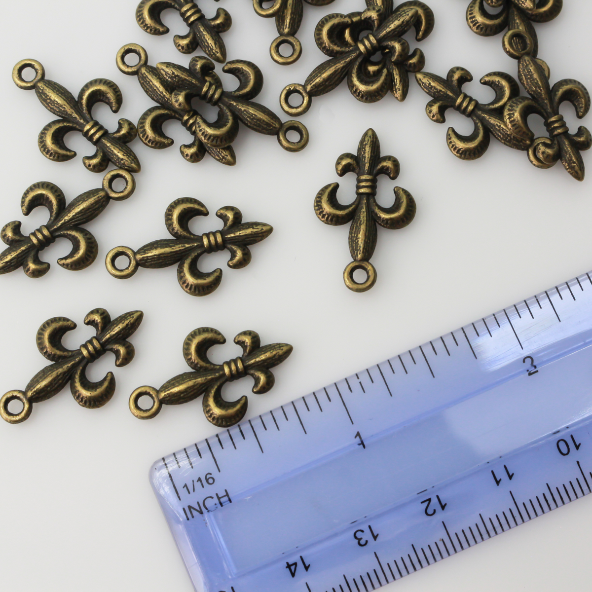 Antiqued bronze fleur de lis charm, 24mm long