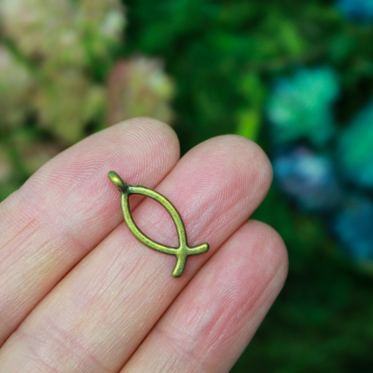 Bronze-tone fish-shaped charm also known as the Ichthys symbol for Jesus