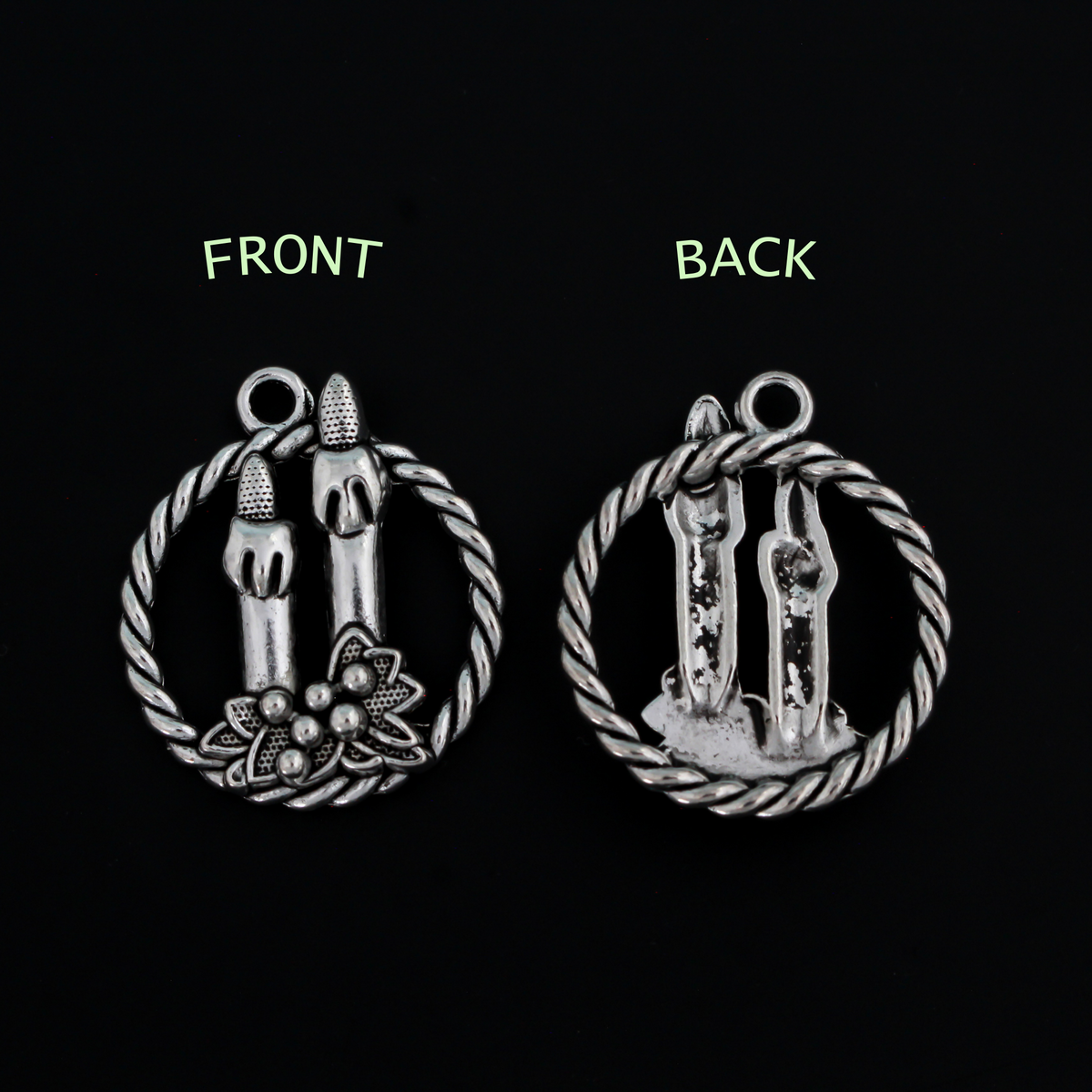 Silver tone charms of a Christmas wreath with two candles, 30mm long