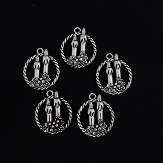 Silver tone charms of a Christmas wreath with two candles, 30mm long