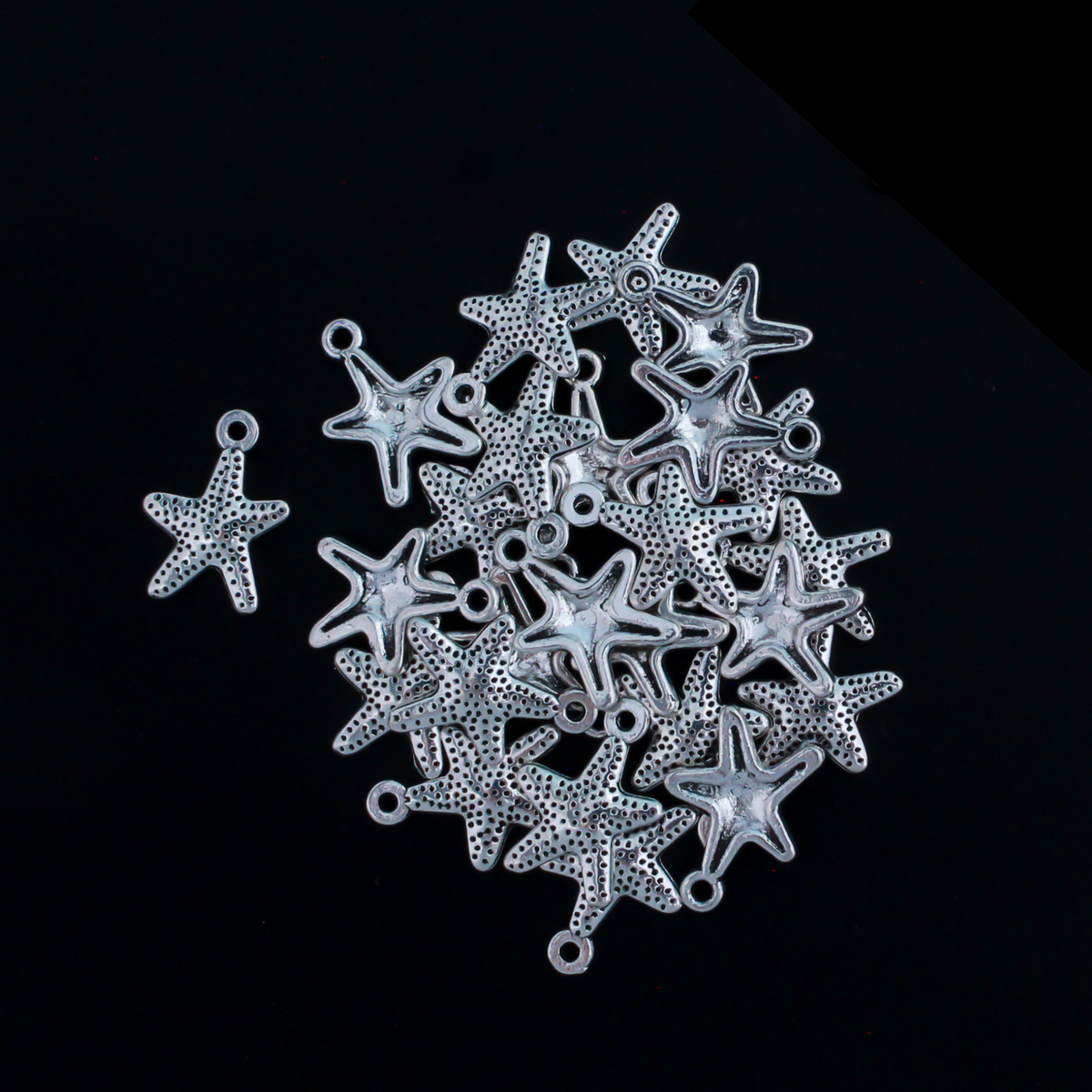 16mm long starfish charms in an antiqued silver-tone color