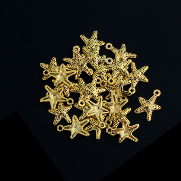 16mm long starfish charms in an antiqued golden color.