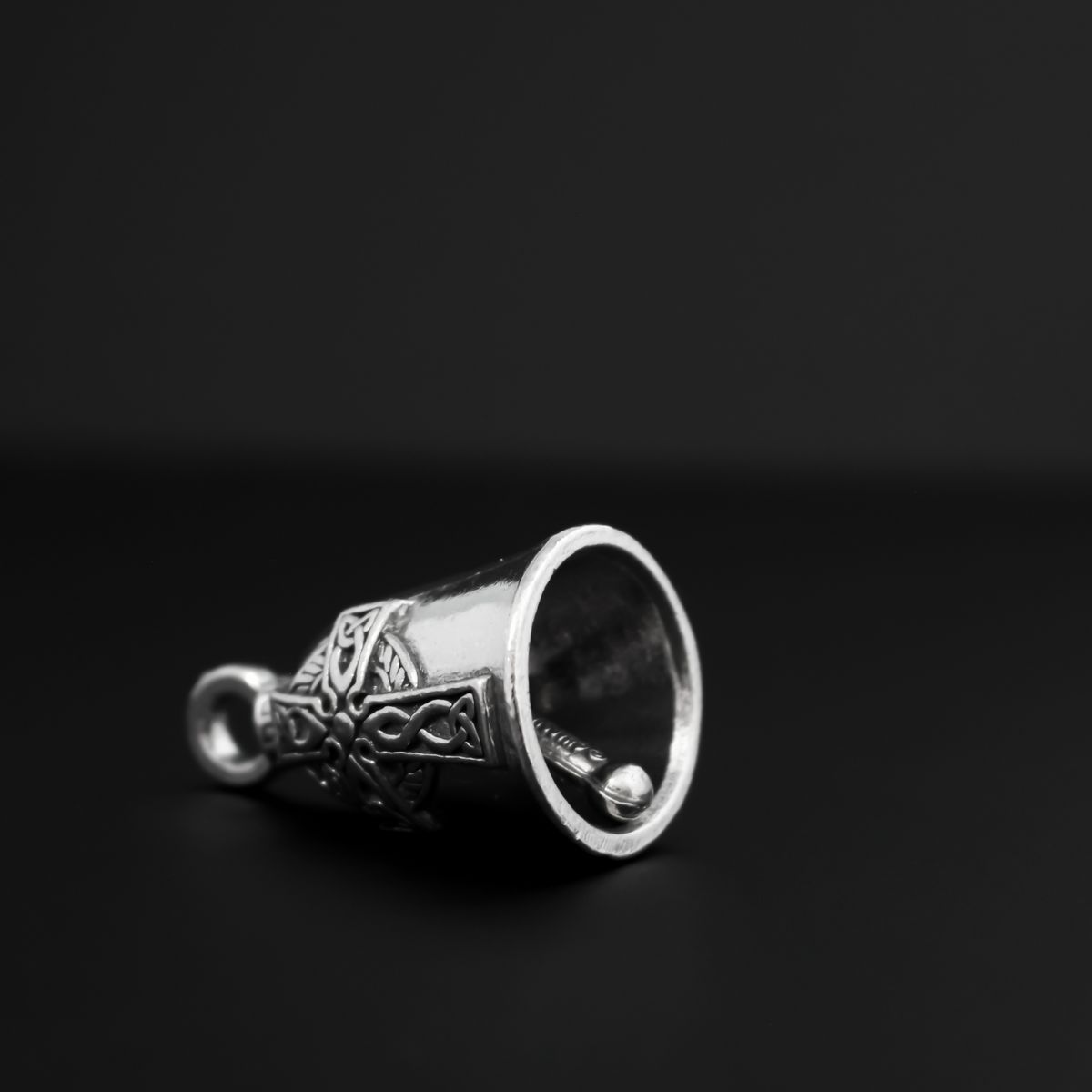 Celtic Cross Guardian bell. There is a large Celtic cross on the front of the bell, the backside is blank.