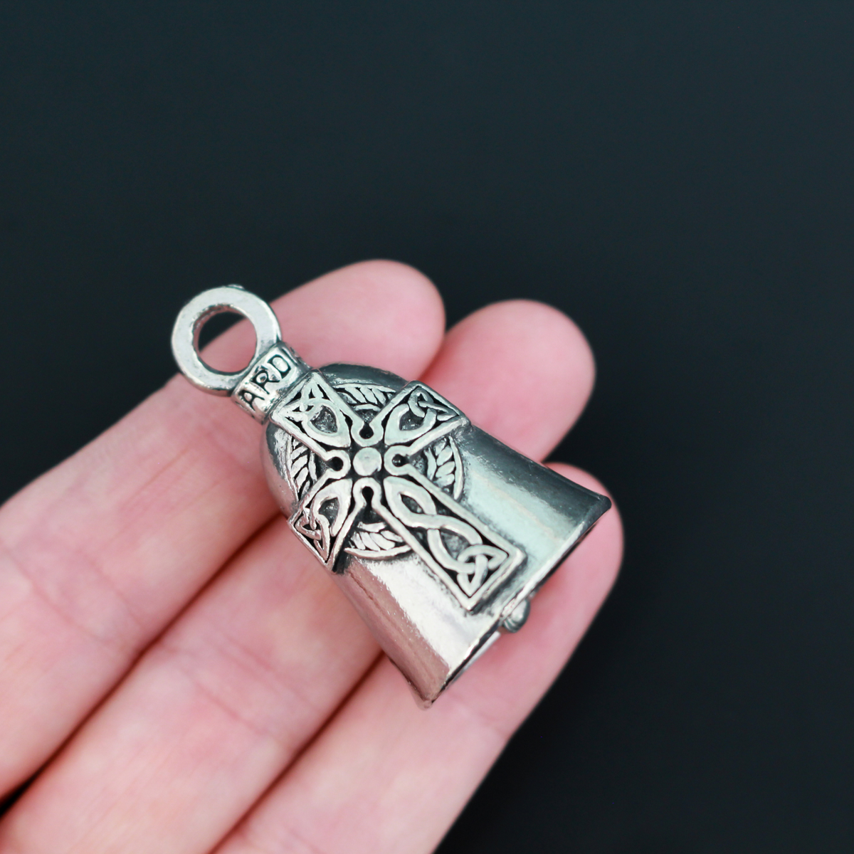 Celtic Cross Guardian bell. There is a large Celtic cross on the front of the bell, the backside is blank.