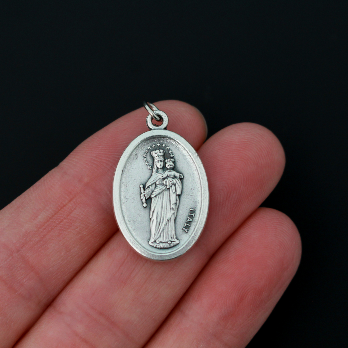 Saint Giovanni "Don" Bosco oval medal that depicts St. Don Bosco on the front and Mary, Help of Christians, on the bac