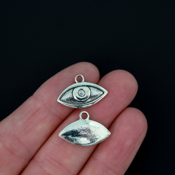 Human eye shaped charms in antiqued silver tone finish, 19mm x 13mm