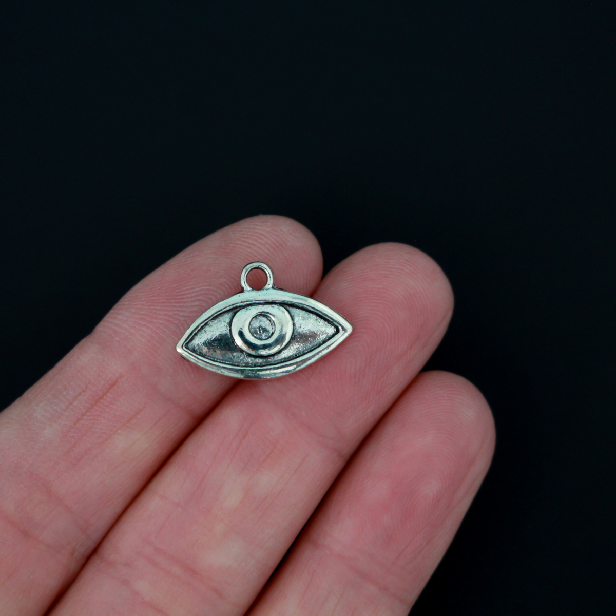 Human eye shaped charms in antiqued silver tone finish, 19mm x 13mm