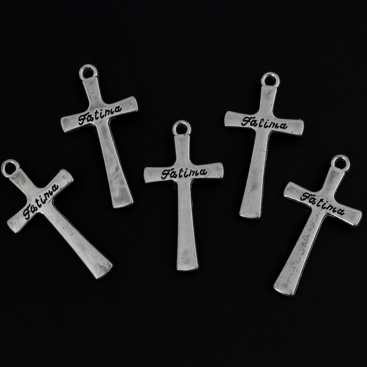 Crucifix cross charm marked "Fatima" on the backside