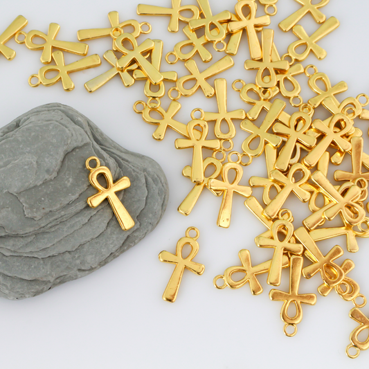 Egyptian Ankh cross charms that are a zinc alloy base with a shiny gold plating.