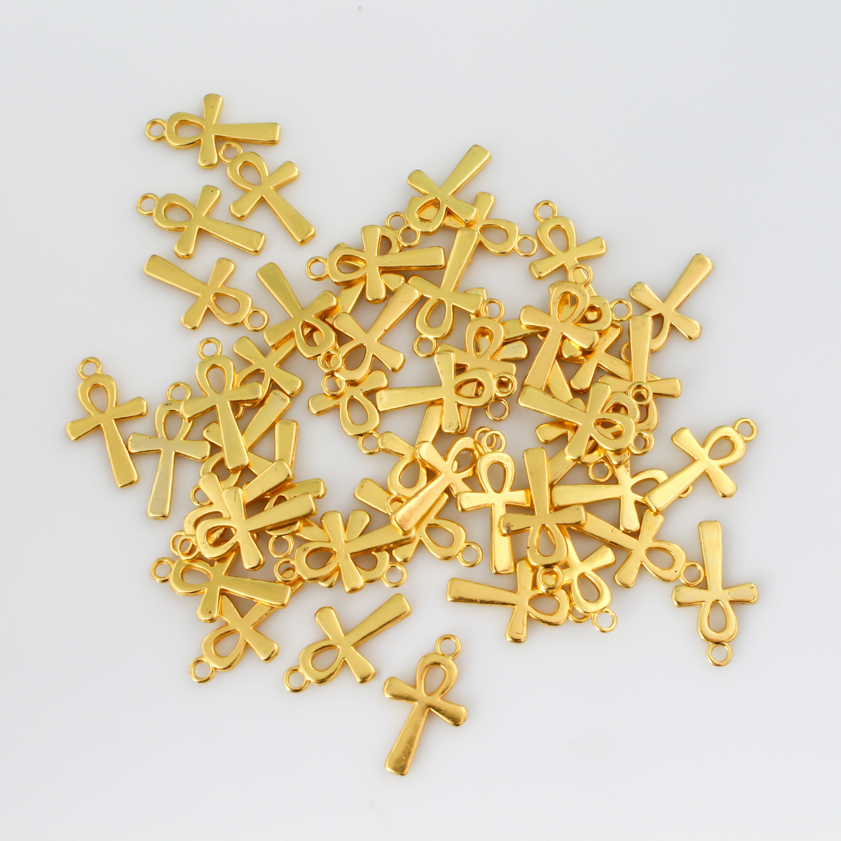 Egyptian Ankh cross charms that are a zinc alloy base with a shiny gold plating.
