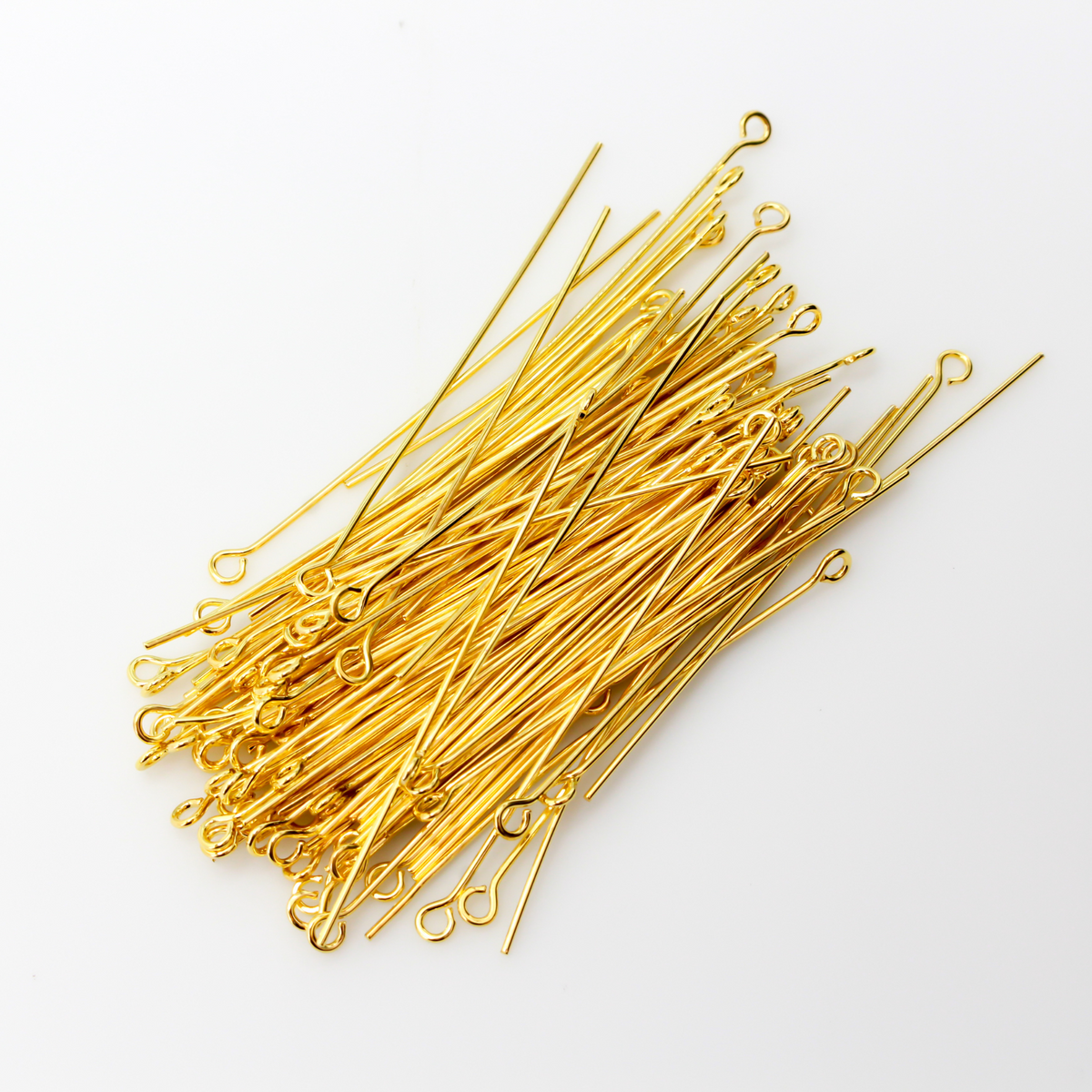 Brass eye pins with a shiny gold plating. They are 50mm long and 0.7mm thick (21 gauge)