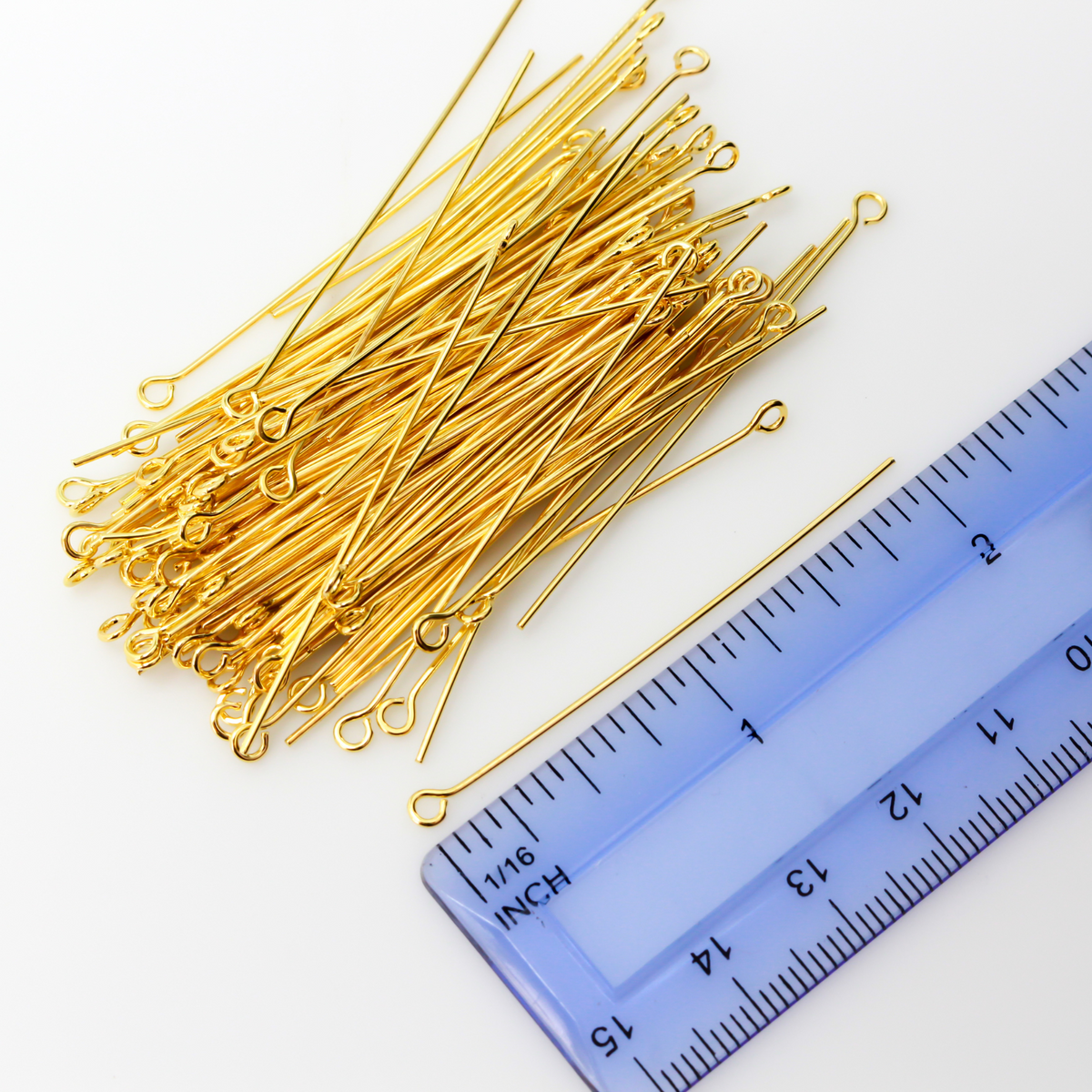 Brass eye pins with a shiny gold plating. They are 50mm long and 0.7mm thick (21 gauge)