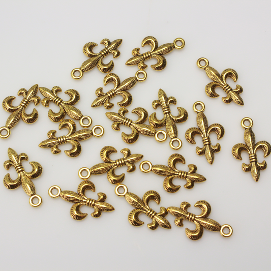 Antiqued gold tone fleur de lis charm, 24mm long