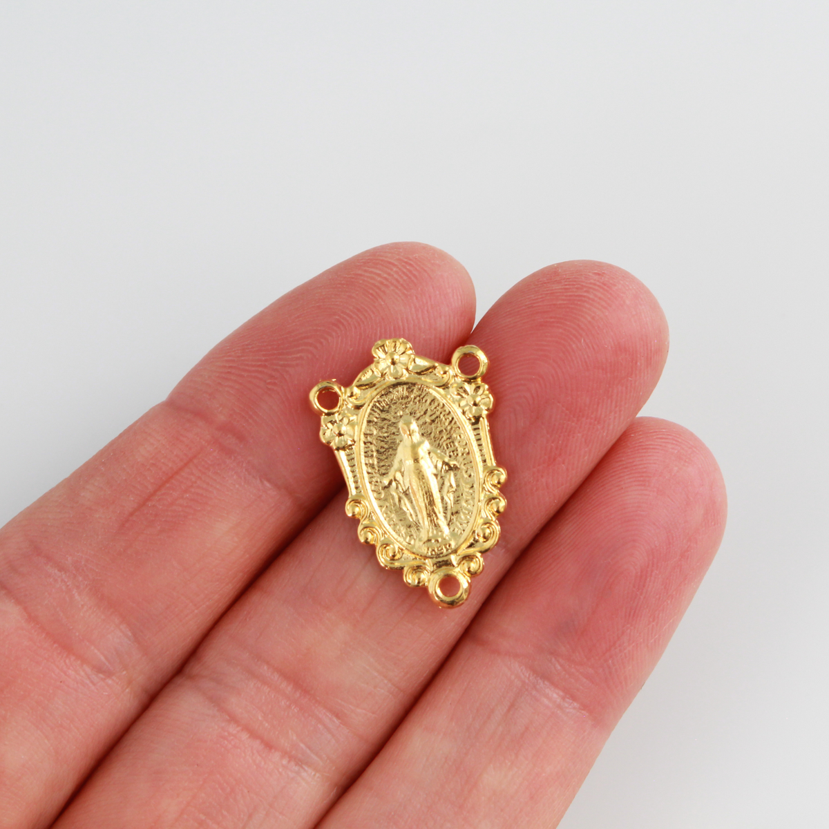 Traditional Miraculous Mary rosary centerpiece. This gold plated centerpiece has gorgeous detail and would be a lovely addition to your next rosary