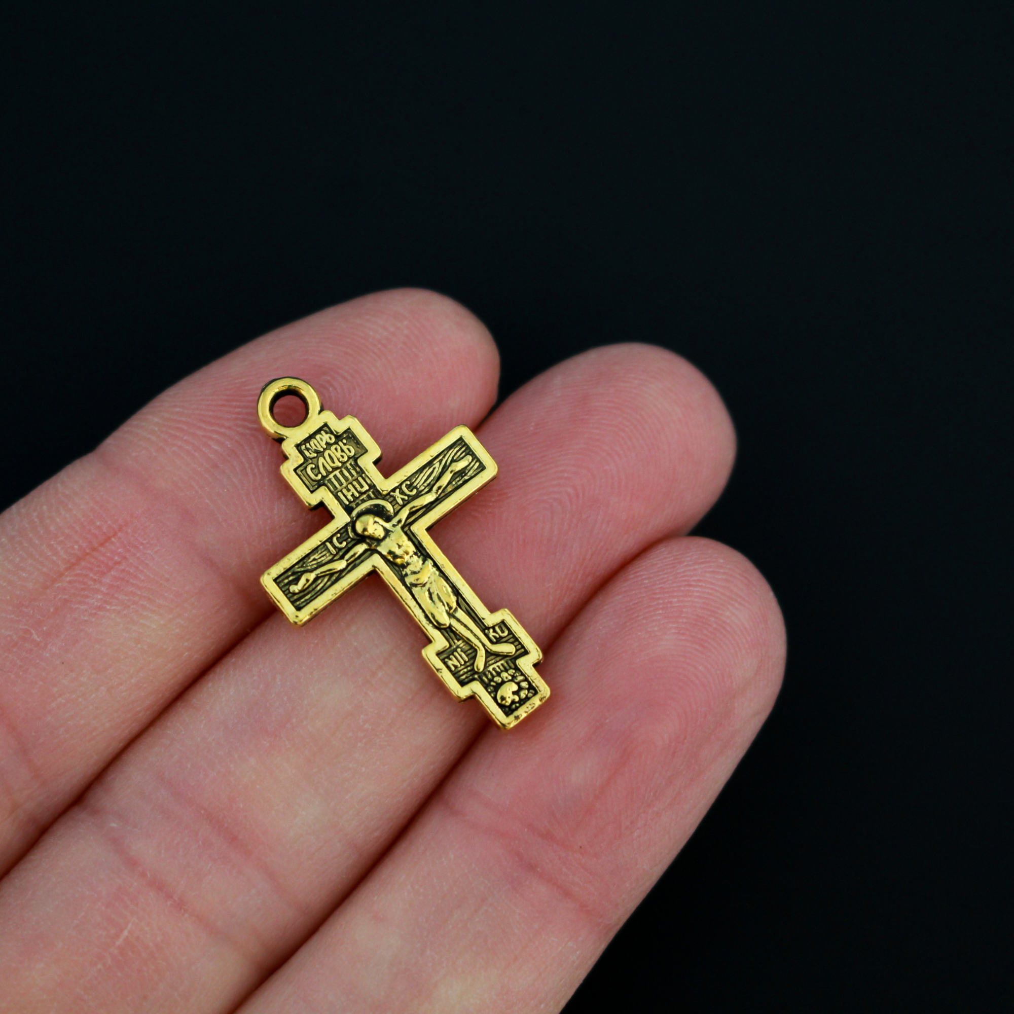 Eastern Orthodox crucifix charms in an antiqued gold finish, one inch long