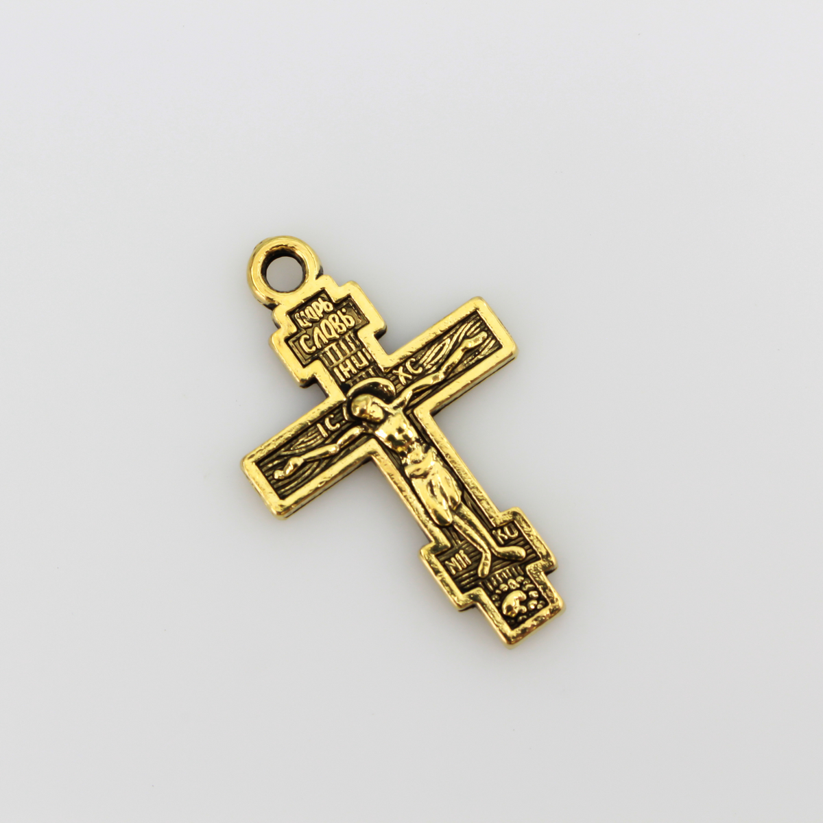 Eastern Orthodox crucifix charms in an antiqued gold finish, one inch long