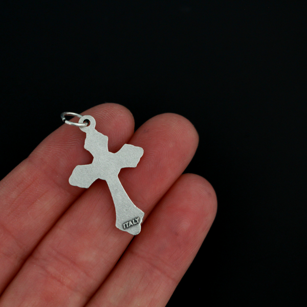 Small silver tone crucifix that features beautiful grape and leaf accents around the figure of Christ on the cross
