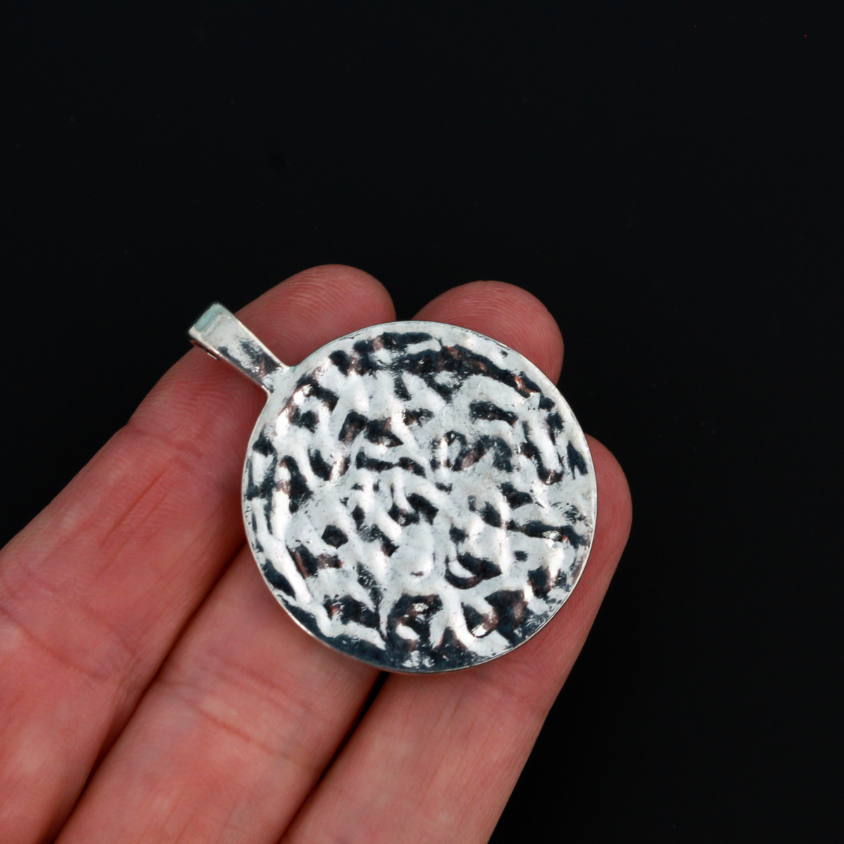 Large Celtic trinity knot pendant that is antiqued silver tone in color with a large attached bail