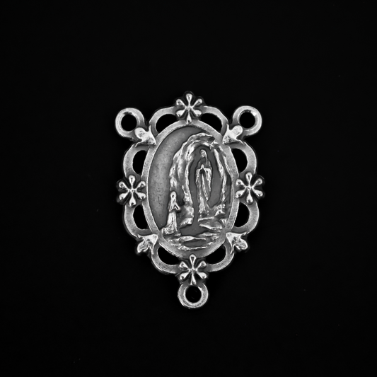 Our Lady of Lourdes rosary centerpiece. This silver oxidized rosary centerpiece has gorgeous details with filigree cut out design and floral detailing