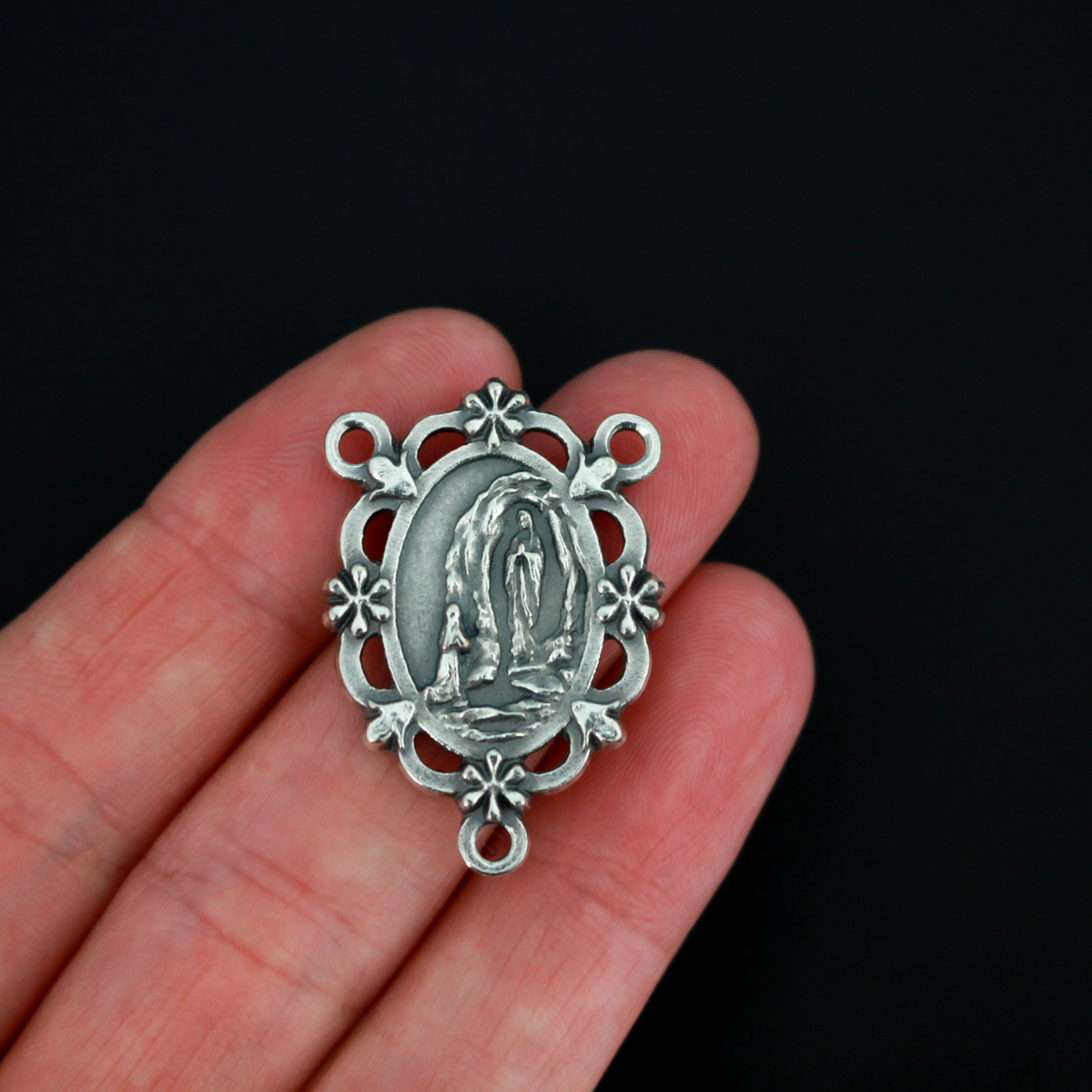Our Lady of Lourdes rosary centerpiece. This silver oxidized rosary centerpiece has gorgeous details with filigree cut out design and floral detailing