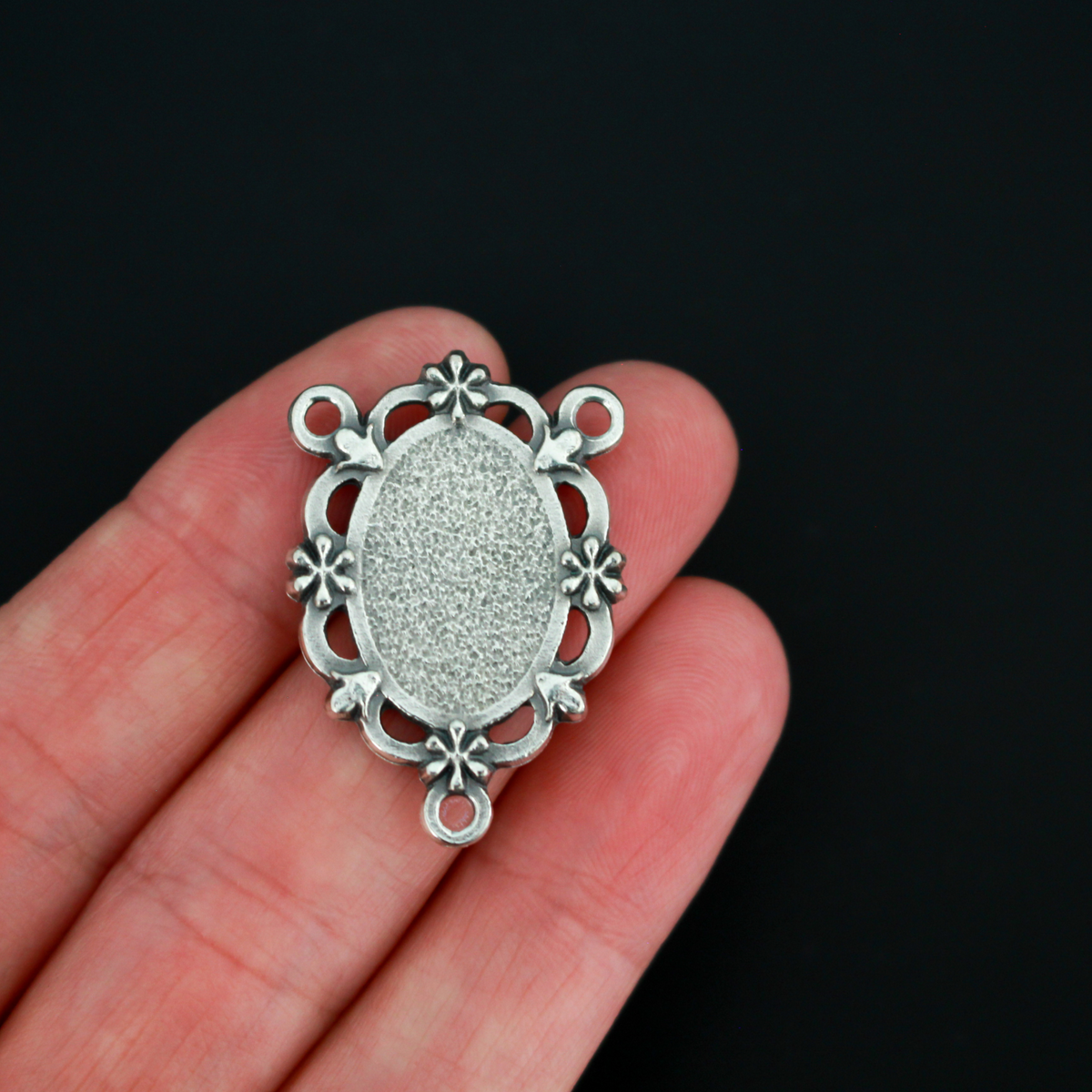 Our Lady of Lourdes rosary centerpiece. This silver oxidized rosary centerpiece has gorgeous details with filigree cut out design and floral detailing