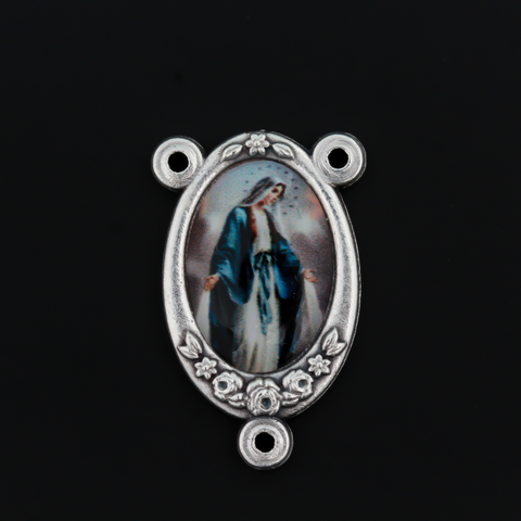 Rosary center that has a color image of Our Lady of the Miraculous Medal inlaid in a silver oxidized center with a flower detail on the edge