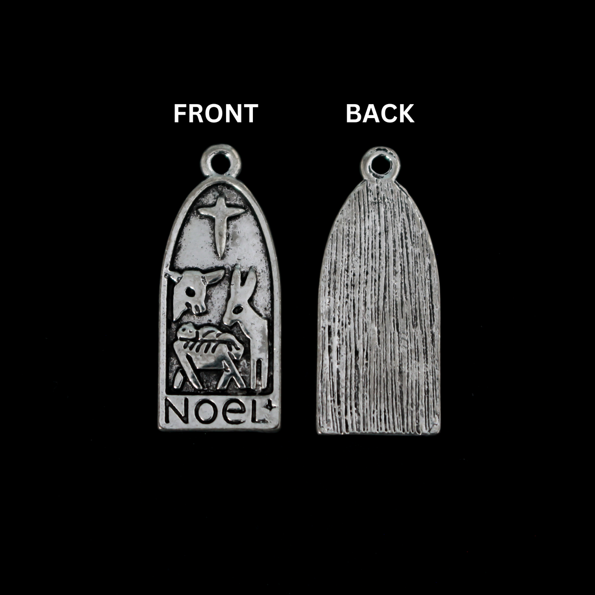 Arched charm depicting Christ child in the manger with the Christmas Star or the Star of Bethlehem above and a donkey and cow on either side