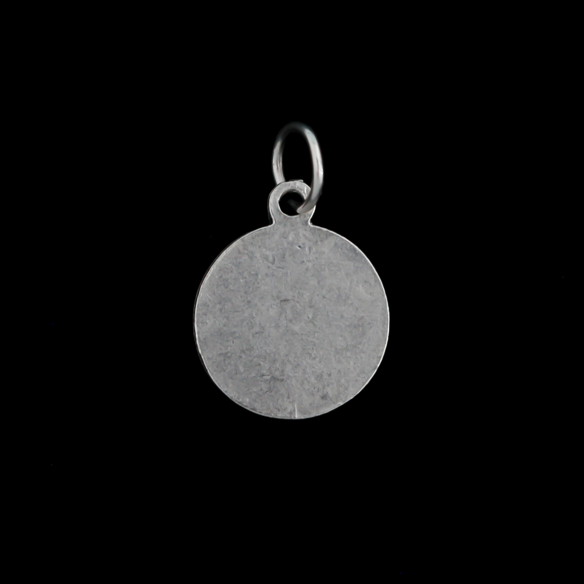Our Lady of Sorrows medal that has a unique scalloped border. The backside is blank.