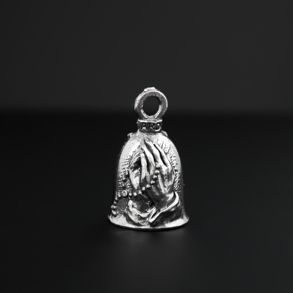 Praying hands Guardian bell. The front of the bell depicts a pair of hands in prayer holding a rosary. The rosary is also on the backside of the bell.