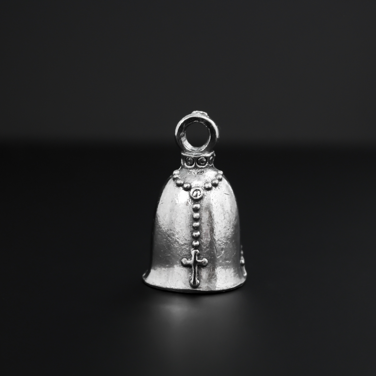 Praying hands Guardian bell. The front of the bell depicts a pair of hands in prayer holding a rosary. The rosary is also on the backside of the bell.
