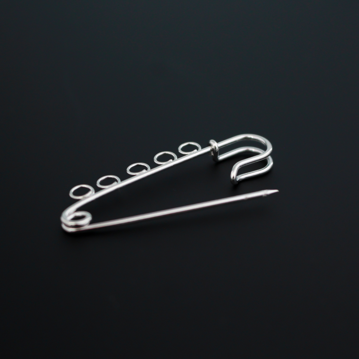 Safety pin brooch pin with five loops so you can easily attach your patron saint medals