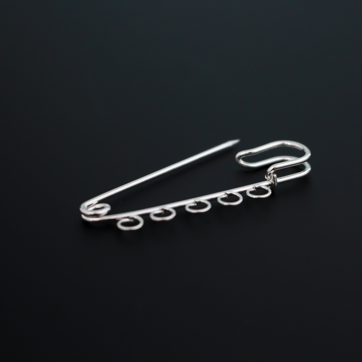 Safety pin brooch pin with five loops so you can easily attach your patron saint medals