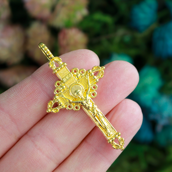 Three ornate crucifix crosses in a shiny gold color. This is a larger size crucifix measuring 2" long.
