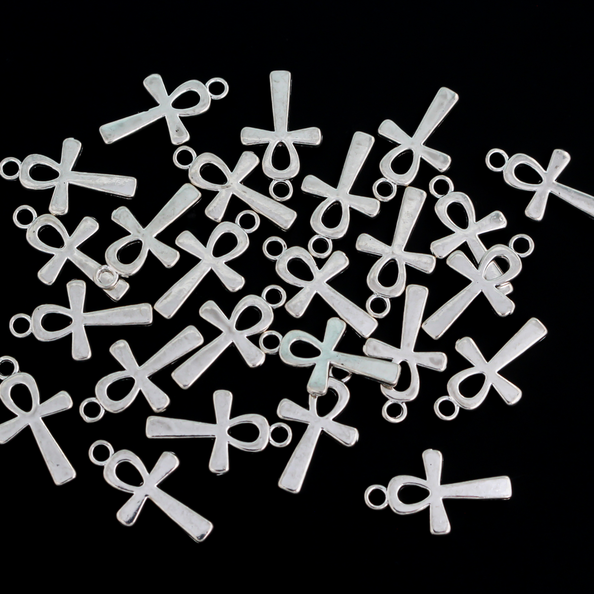 Egyptian Ankh cross charms that are a zinc alloy base with a shiny silver plating