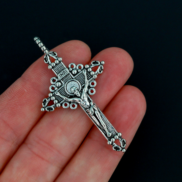 Three ornate crucifix crosses in an antiqued silver-tone color. This is a larger size crucifix measuring 2" long