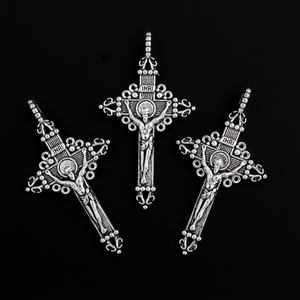 Three ornate crucifix crosses in an antiqued silver-tone color. This is a larger size crucifix measuring 2" long