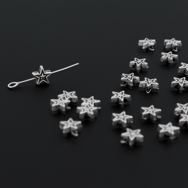 Tiny silver-tone metal beads shaped like five pointed stars, 6mmx6mm