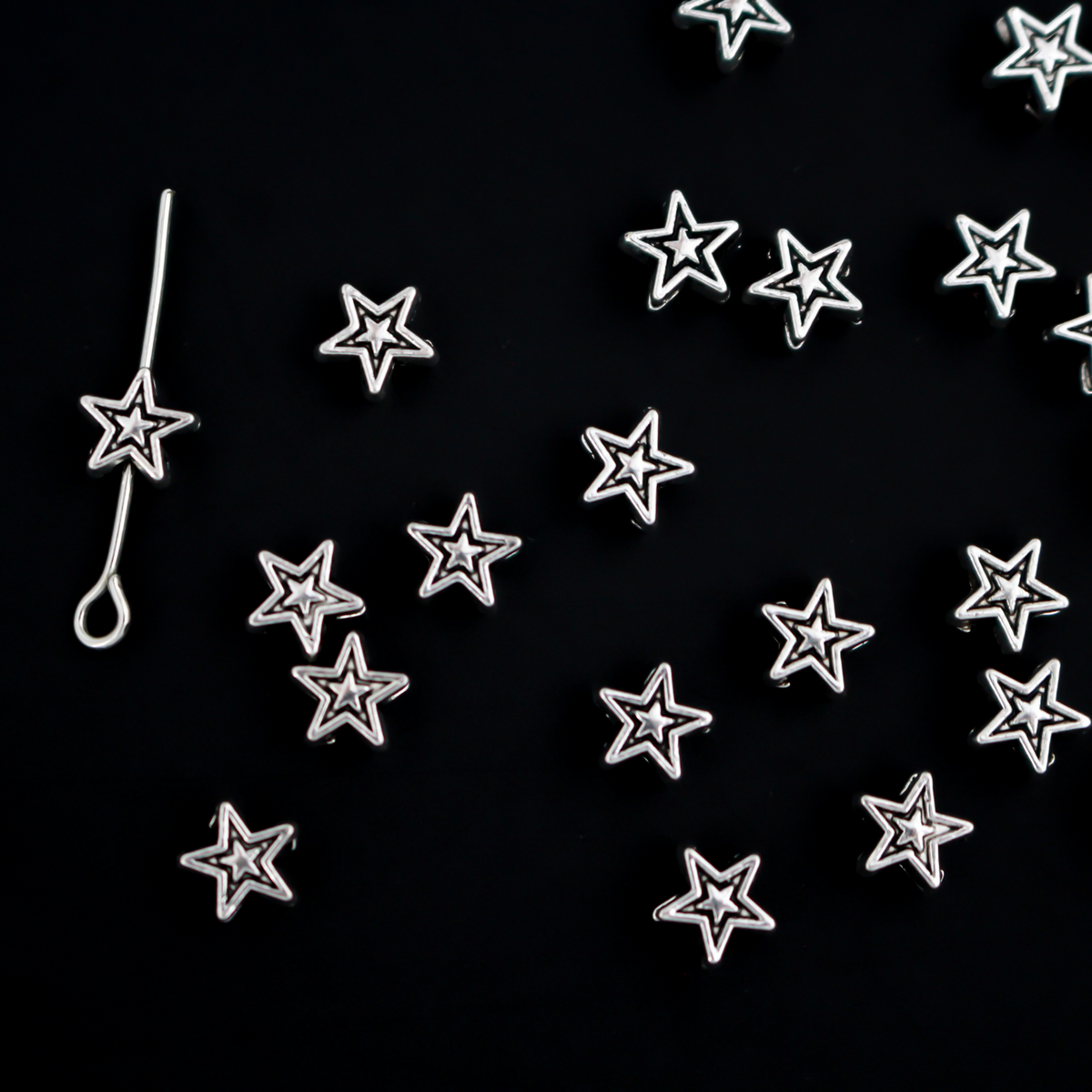 Tiny silver-tone metal beads shaped like five pointed stars, 6mmx6mm